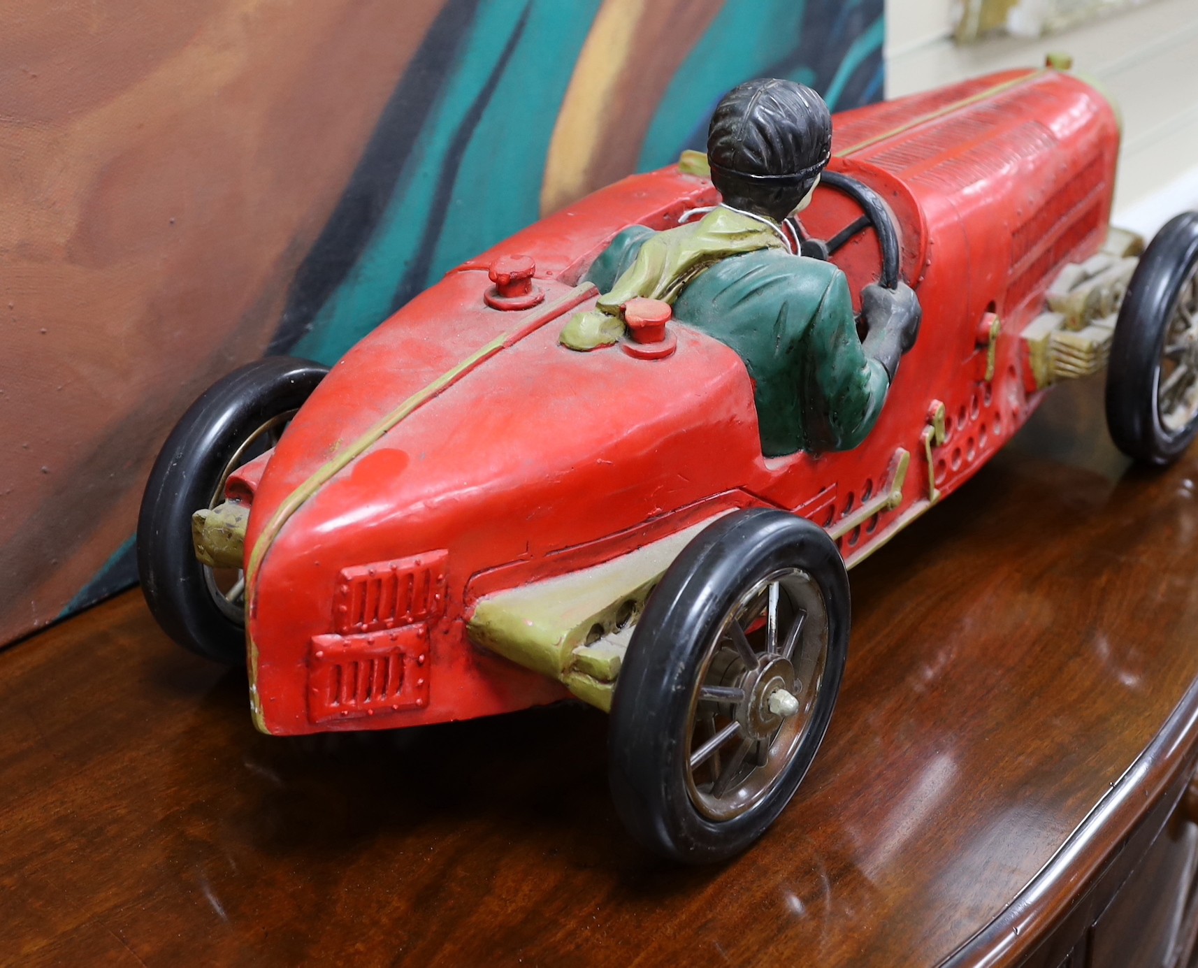 A resin model of an early 20th century Grand Prix racer in a Bugatti type 35